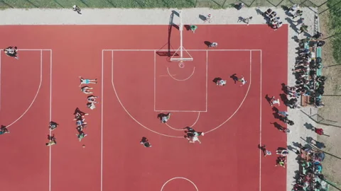 Aerial view of a player throwing the ball into the basket. Stock Footage 207383164