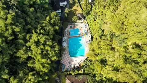 Aerial view of The Plot of land with house and swimming Pool Aerial Shot Fotos de archivo