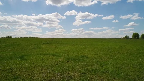 Aerial view of ploughed fields and cloud forest of the Siberian landscape Stock Footage 75810611
