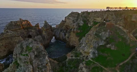 Aerial view of the point dramatic cliffs and lighthouse of Ponta da Piedade at 스톡 동영상 311501578