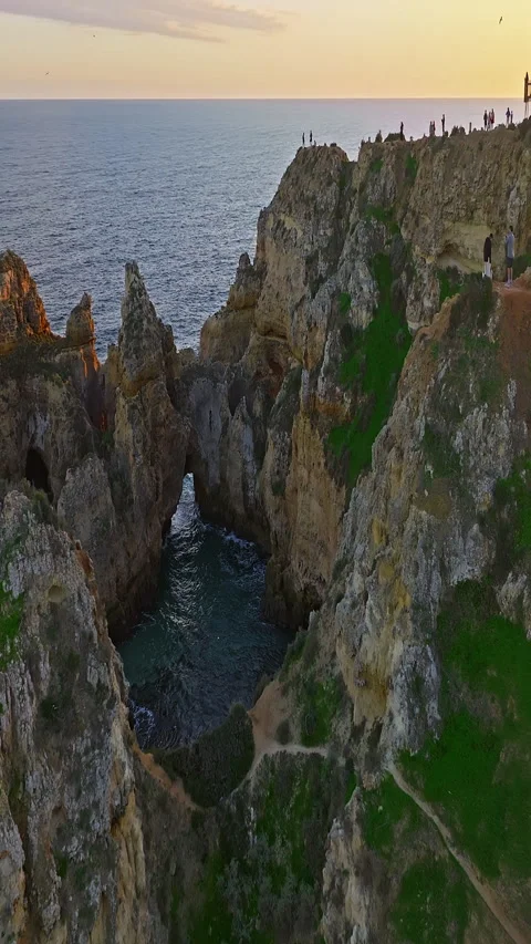 Aerial view of the point dramatic cliffs and lighthouse of Ponta da Piedade at 스톡 동영상 318956995