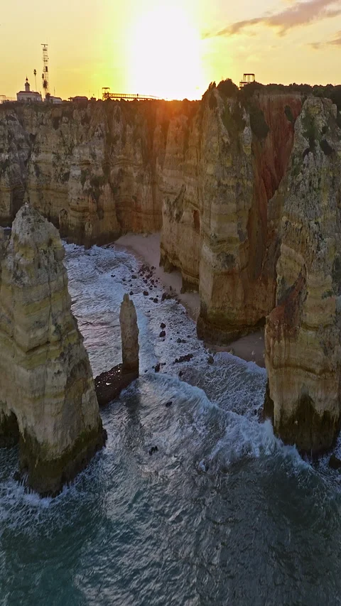 Aerial view of the point dramatic cliffs and lighthouse of Ponta da Piedade at 库存影片 320876795