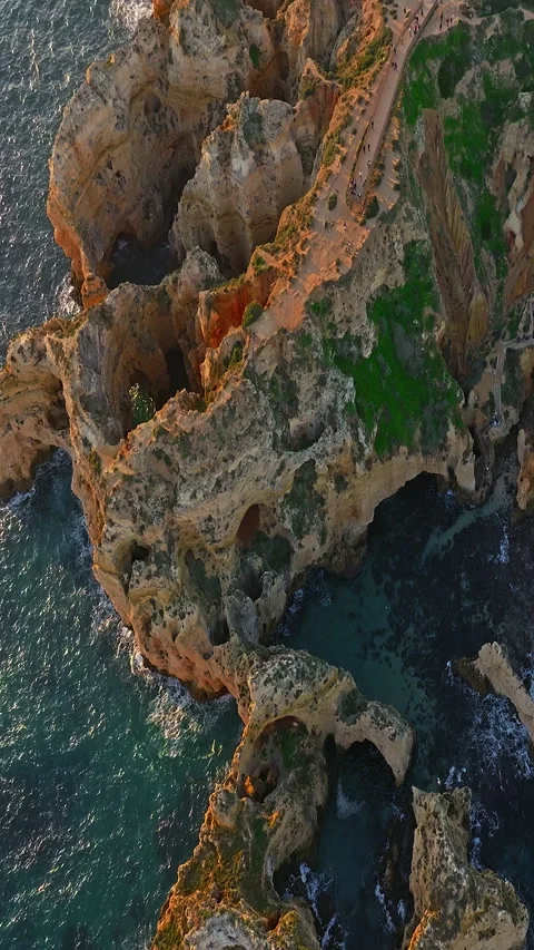 Aerial view of the point dramatic cliffs and lighthouse of Ponta da Piedade at 스톡 동영상 320877233