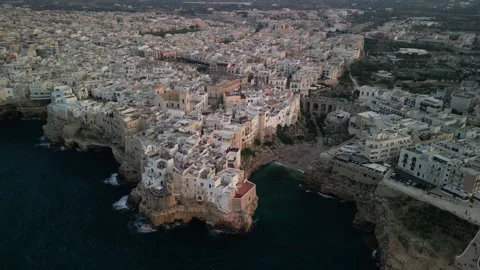 Aerial view of Polignano a mare at sunset in the province of Bari in Puglia Stock Footage 250374909