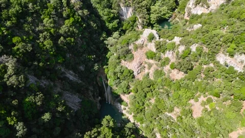 Aerial View of Polylimnio Waterfall and Canyon Pools Stock-Footage 334898846