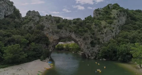 Aerial View of Pont d'Arc - Stone Arch over Ardèche River with Lush Greenery Stock Footage 288526447