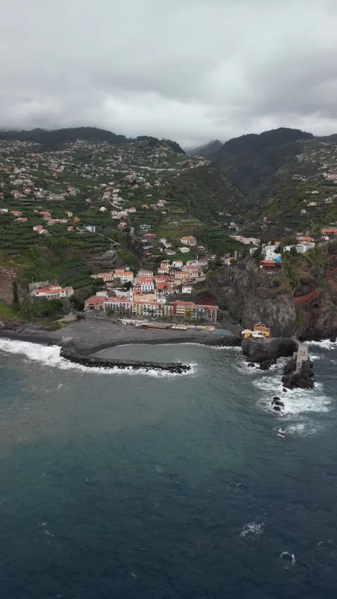 Aerial view of Ponta do Sol, Madeira island. Cozy resort village with colorful Stock Footage 269902715