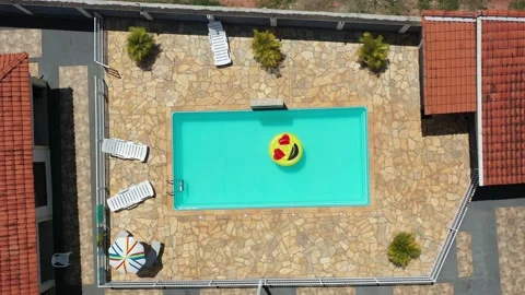 Aerial View Of Pool Float In The Swimming Pool Stock Footage 140388212