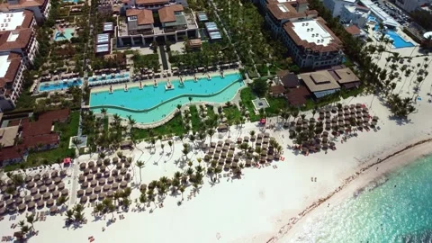 Aerial view of pool on the grounds of a luxury hotel in the tropics. Palm trees 스톡 동영상 274372010