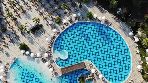 Aerial view on pool side and lounge bar chairs in family hotel resort Stock Footage 172362444