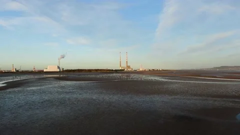 An aerial view of Poolbeg Generating Station from Sandymount Strand Stock Footage 144851314