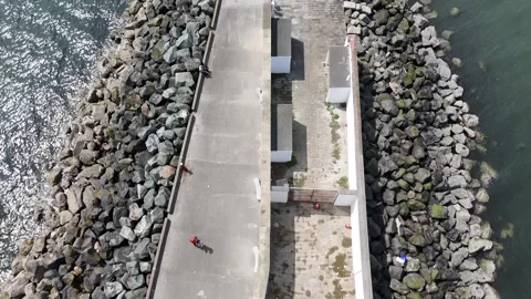 Aerial view of Poolbeg Lighthouse, The red Poolbeg Lighthouse in Dublin Stock Footage 279546902