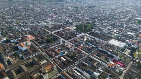 Aerial view of Popayán tiled rooftops and church dome Vídeo Stock 331254634