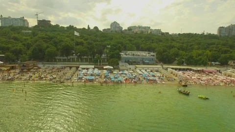 Aerial View. Popular сity beach. Many sun umbrellas at the coast, 4K Video stock 78059150