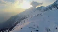 Aerial view of popular ski resort in Alps, mountains covered with snow, cableway 4k or 4k+ Resolution