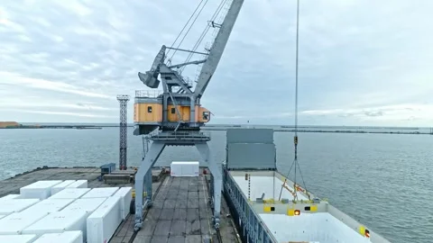 Aerial view of port crane loading cargo ship in Riga, Latvia. 스톡 동영상 340565371