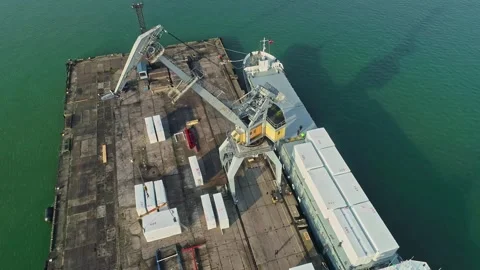 Aerial view of port crane loading cargo ship in Latvia. Stock Footage 340813071