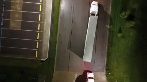 Aerial view of a potential traffic jam with trucks and trailers. Overhead Stock Footage 311804701