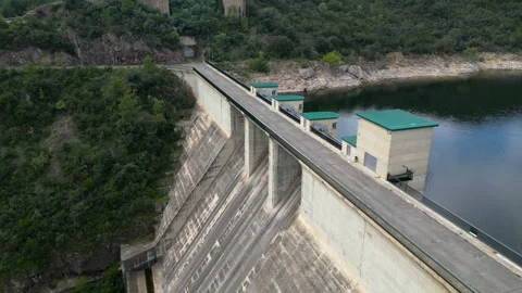 Aerial view of a power-generating dam with a water reservoir Stock Footage 321946439