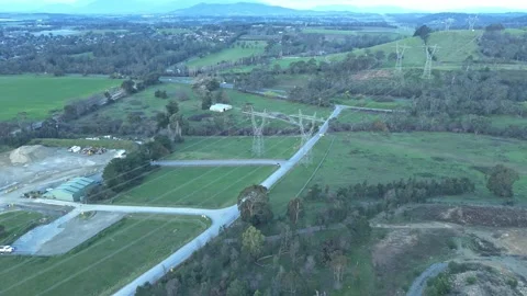 Aerial view of power lines over green rural landscape Vidéo 342530497