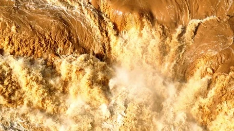Aerial view of powerful flash flood water flow. Stockbeeldmateriaal 341906970