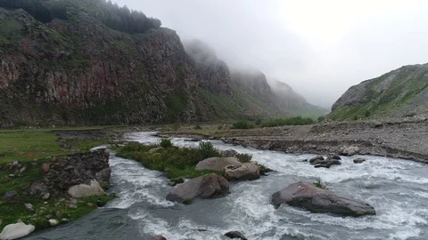 Aerial view of  powerful mountain river in deep gorge. Stock Footage 91016684