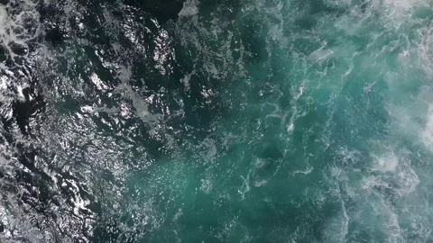 Aerial View of Powerful Ocean Waves Crashing Against Rocky Shore Stock Footage 304089073