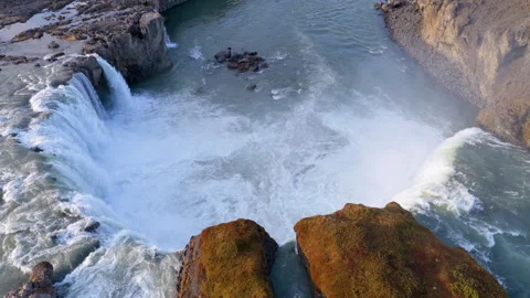 Aerial view of Powerful waterfall Godafoss pouring into a rocky basin. Iceland Stock Footage 337319274