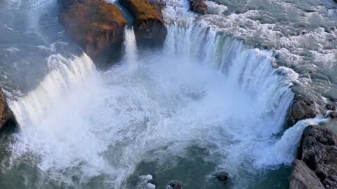 Aerial view of Powerful waterfall Godafoss pouring into a rocky basin. Iceland Stock Footage 345168103