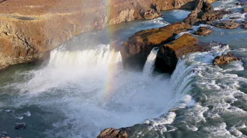 Aerial view of Powerful waterfall Godafoss pouring into a rocky basin. Iceland Stock Footage 345168260