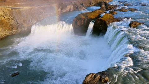 Aerial view of Powerful waterfall Godafoss pouring into a rocky basin. Iceland Stock Footage 345168770