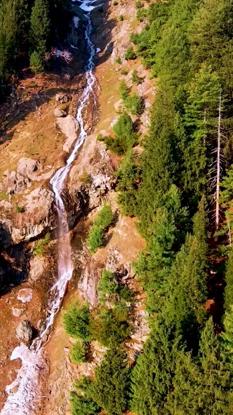 Aerial view of a powerful waterfall in the mountains Stock Footage 336718690