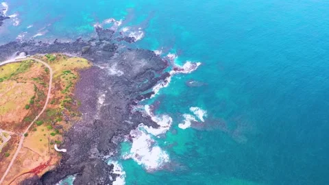 Aerial view of powerful waves crashing coastline of Jeju Island, South Korea Stock Footage 296559642