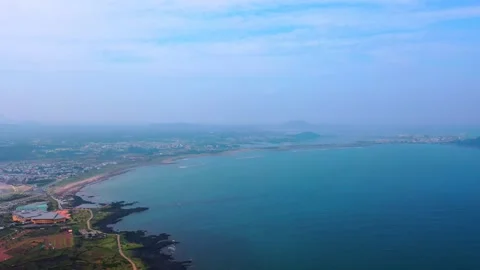Aerial view of powerful waves crashing coastline of Jeju Island, South Korea Stock Footage 296559799
