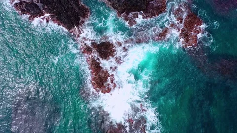 Aerial view of powerful waves crashing coastline of Jeju Island, South Korea Stock Footage 296561382
