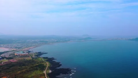 Aerial view of powerful waves crashing coastline of Jeju Island, South Korea Stock Footage 296562152