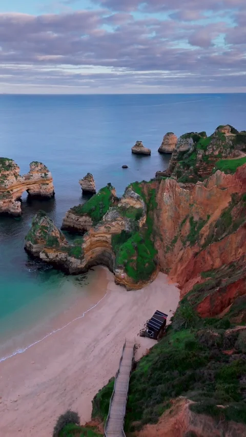 Aerial View of Praia do Camilo Beach at Sunset in Lagos, Algarve, Portugal Stock Footage 327042011