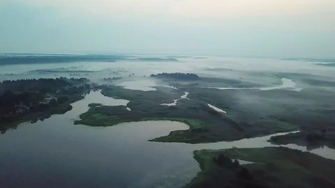 Aerial view of pre-dawn mist over lakes Stock Footage 115355492