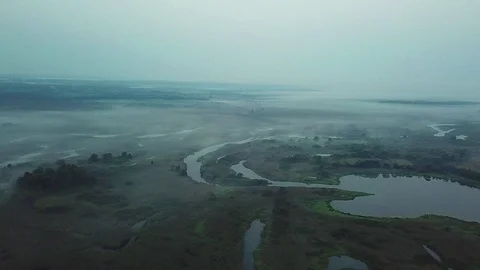 Aerial view of pre-dawn mist over lakes Stock Footage 116987670