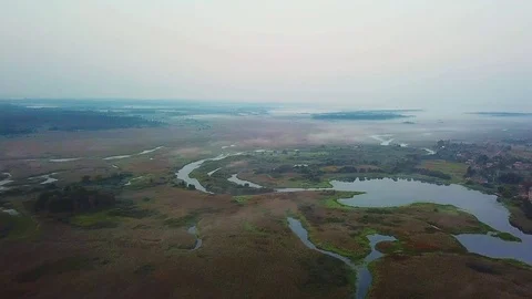 Aerial view of pre-dawn mist over lakes Stock Footage 118529546