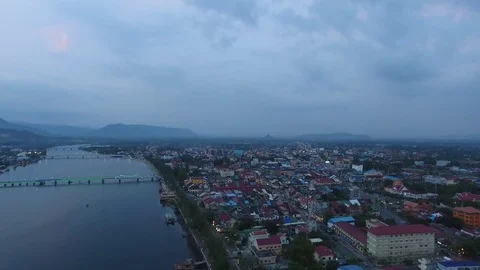 Aerial view of Prek Kampong river with city buildings -  Kampot, Cambodia Stock Footage 83535337
