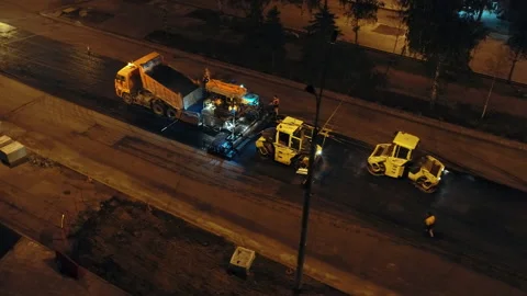 Aerial view. Preparation for unloading the asphalt concrete mixture into the Stock Footage 154302899