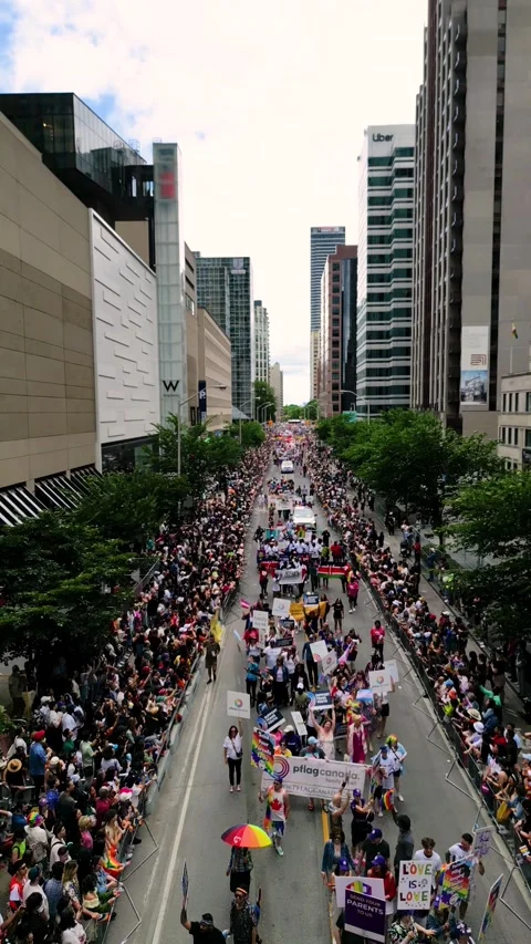 Aerial View of Pride Parade Marching Through Downtown Toronto Street Video stock 332018040