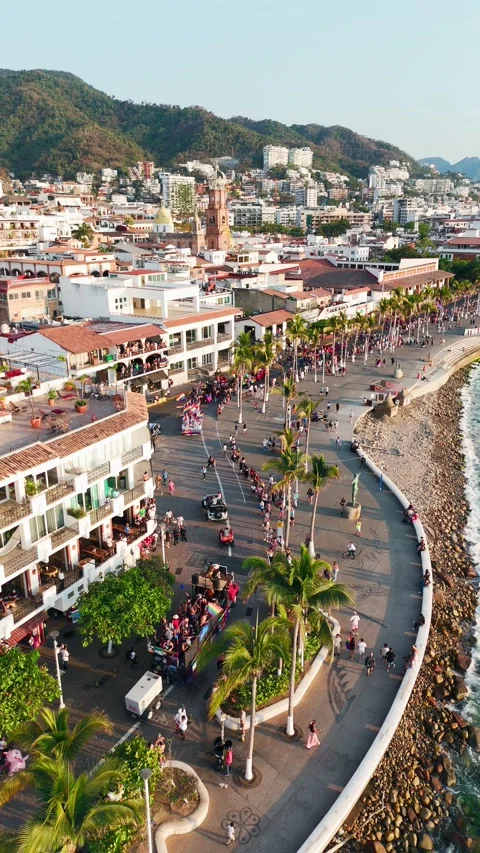 Aerial view of pride parade passing through downtown puerto vallarta, mexico Stock Footage 310547437