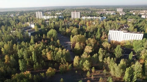 Aerial view of Pripyat ferris wheel and abandoned apartment blocks, Ukraine. Stock Footage 345080087