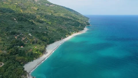 Aerial view of the pristine coastline of Analipsi Beach on the eastern side of Stock Footage 346703121
