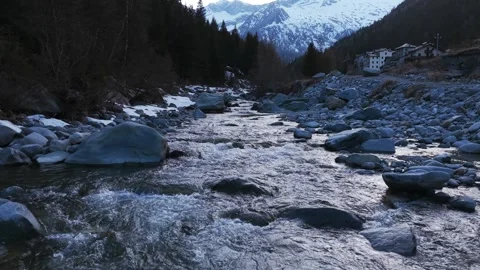 Aerial View of a Pristine Mountain River Flowing Through Alpe Ventina in the Vidéo 341327311