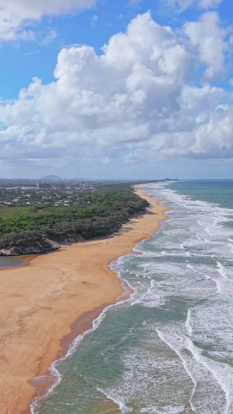 Aerial view of pristine tropical beach coastline with waves and blue sky Video stock 334785500