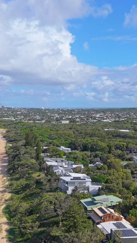 Aerial view of pristine tropical beach coastline with waves and blue sky Stock Footage 334785526
