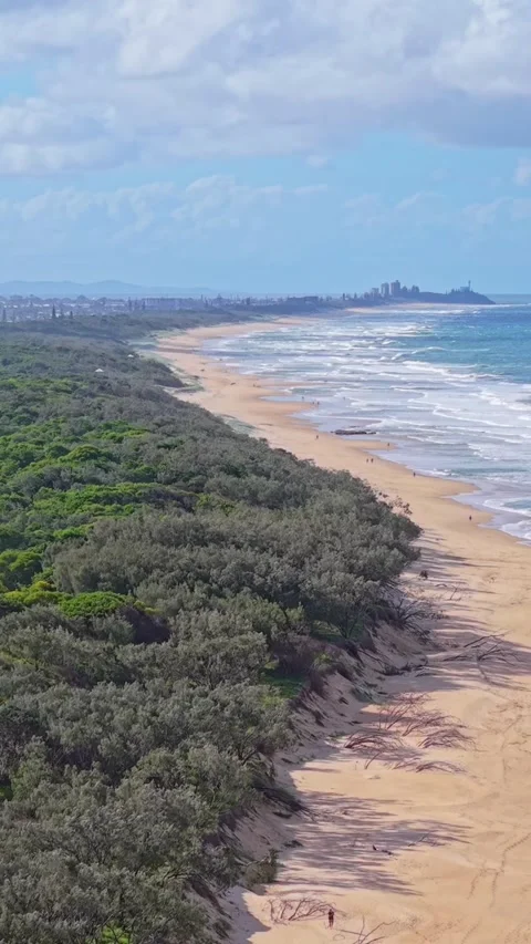 Aerial view of pristine tropical beach coastline with waves and blue sky Stock Footage 334785561